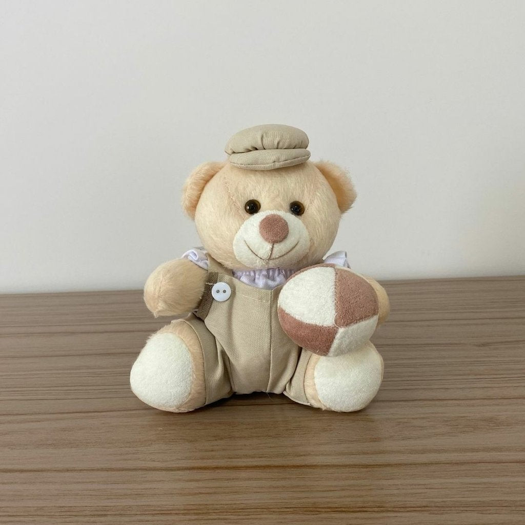 Ursinho De Pelúcia Com Brinquedo (Bege) - 12cm